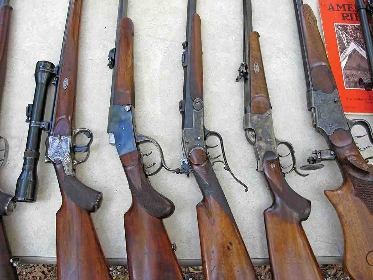 A table full of fine German stalking rifles.